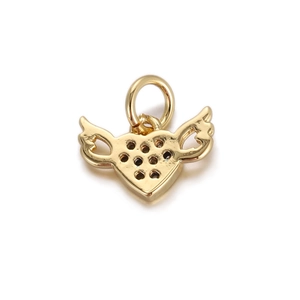 Detail of a golden heart pendant with wings featuring micro-pave hole structure