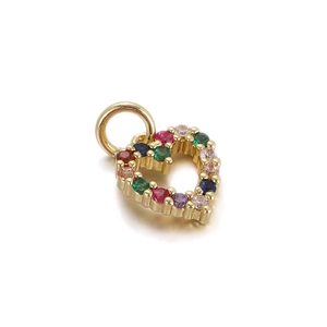 Detail of a heart-shaped gold pendant featuring multi-colored micro-pave zirconia stones