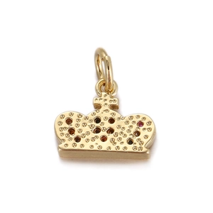 Macro shot of crown charm in gold finish with colorful mini stones and grainy texture