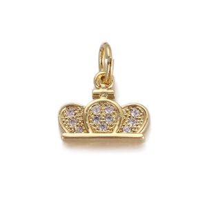 Macro detail of golden crown pendant charm with sparkling white micro-set crystals