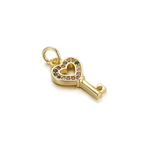 Detailed close-up of golden heart key pendant with colorful crystal stones for DIY jewelry