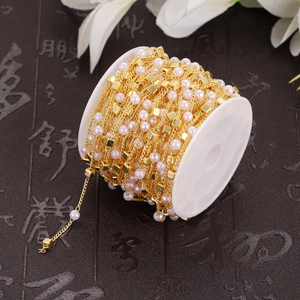 14K gold plated stainless steel chain with pink pearls and square beads on a spool