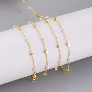 Elegant 14K gold plated necklace with delicate white pearls and metal cube beads