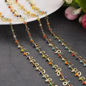 Bohemian gold chain with colorful enamel beads and circular charms for glasses and jewelry