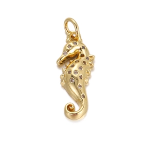 Detailed view of a gold-plated seahorse pendant with sparkling cubic zirconia inlay