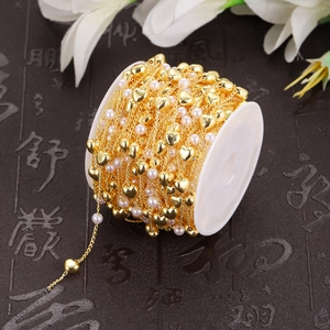 Roll of gold DIY chain with heart charms and white pearls for jewelry making