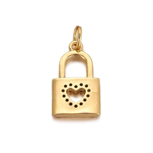 Detail of a golden heart-shaped lock pendant with decorative dots for DIY jewelry