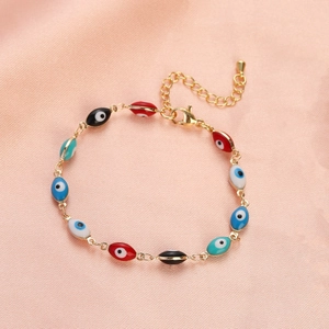 Detail of colorful Evil Eye beaded bracelet with adjustable gold chain and lobster clasp