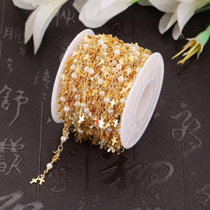 Gold plated stainless steel cross and pearl DIY jewelry chain on a white spool