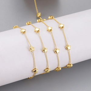 Gold-plated stainless steel star chain for DIY jewelry making displayed on a white stand