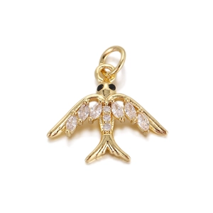 Detailed close-up of a golden bird charm pendant set with sparkling marquise crystals