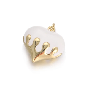 Macro shot of white heart pendant charm with gold metal crown edge for DIY jewelry