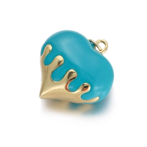 Macro shot of turquoise heart pendant with gold liquid style metal finish for jewelry