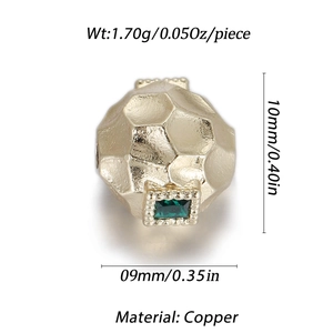 Detailed view of a gold-plated copper honeycomb bead featuring a green zircon gemstone