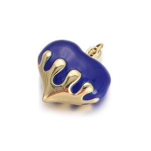 Detailed view of heart-shaped blue enamel pendant with golden crown base for jewelry making