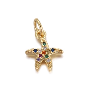 Detailed view of a golden starfish pendant with colorful cubic zirconia and a top loop