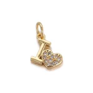 Close-up of golden letter I pendant with a heart-shaped charm set with cubic zirconia stones