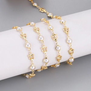 Detail of 1M gold DIY chain with faux pearls and hollow butterfly links for jewelry