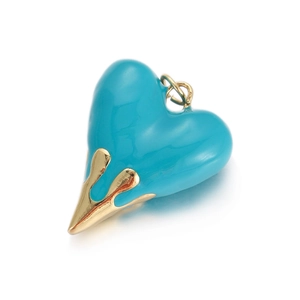 Detail of turquoise lava heart pendant with gold liquid metal dripping effect