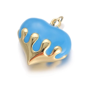 Close-up of blue enamel heart charm with liquid gold drip effect for DIY jewelry