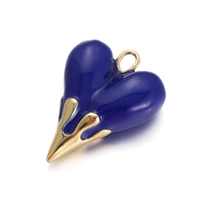 Detailed view of a dark blue heart pendant with asymmetric golden lava drip design