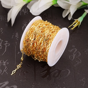 Detailed macro view of gold-plated clover and diamond shape chain for DIY jewelry making