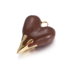 Detail of heart pendant with brown enamel and molten gold metal dripping effect