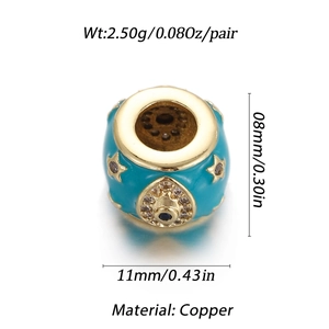 Macro shot of 11mm blue enamel heart charm in copper with gold stars and zircons