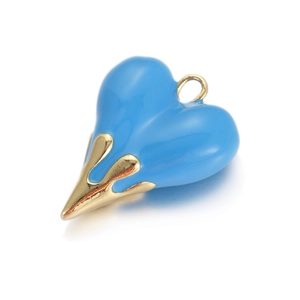 Macro view of blue enamel lava heart pendant with irregular gold base and metal ring