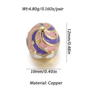Macro view of gold-plated copper enamel bead with pink and purple swirl patterns