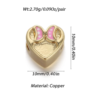 Detailed view of 10mm gold heart charm with pink polka dot bow for jewelry making