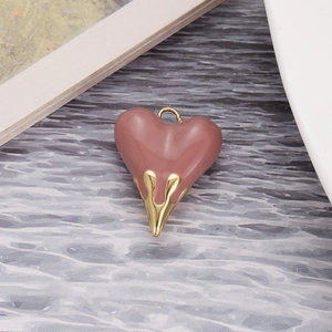 Detail view of pink enamel and gold lava heart pendant charm for DIY jewelry design