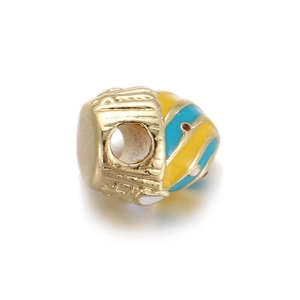 Macro detail of gold-plated barrel beads with yellow, blue, and white enamel for DIY jewelry