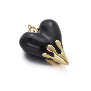 Lava heart pendant in black enamel with gold metallic liquid drip detail on white background