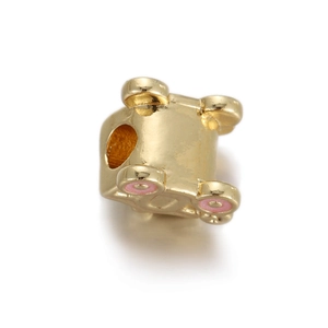 Detail view of gold plated baby stroller bead with pink enamel accents for DIY jewelry
