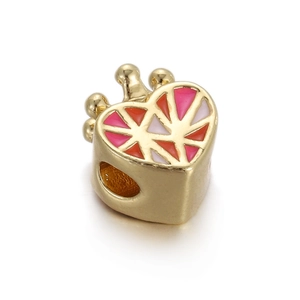 Detailed view of crown-topped gold heart charm with red pink and white enamel inlays