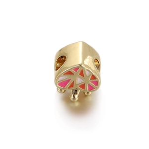 Macro detail of gold-plated enamel heart beads showing precise craftsmanship and center hole