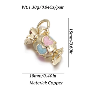 Detail of candy-shaped copper pendant with pink and blue hearts and 15x10mm dimensions