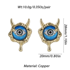 Detail of copper Evil Eye earrings with blue eye inlay and gothic horn design