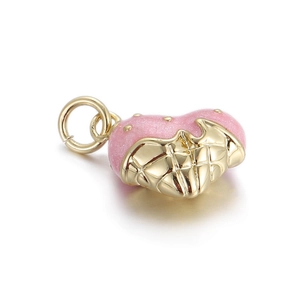 Detail of a pink glitter heart pendant with golden quilted pattern and round hanging ring