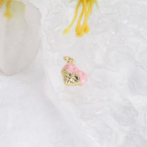 Macro detail of a pink heart ice cream charm with gold plating for DIY jewelry
