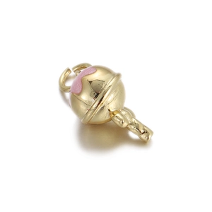 Macro view of gold-plated pendant with pink enamel for DIY jewelry making