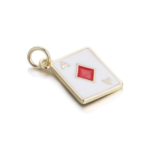 Macro shot of Ace of Diamonds poker pendant with gold metal edge and red enamel detail