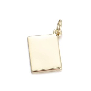 Close-up of golden rectangular metal pendant charm with a jump ring for DIY jewelry