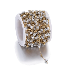 Gouden kralenketting met zirkonia kralen op witte spoel voor DIY sieraden maken