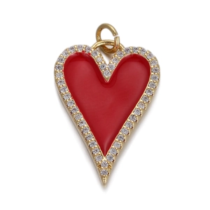 Detail of red enamel heart pendant with gold plating and sparkling zircon border