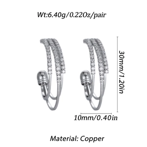 Detailed view of silver-plated copper C-shaped hoop earrings with multi-row cubic zirconia