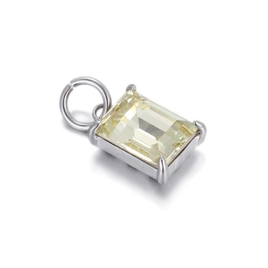 Detail of emerald-cut yellow crystal pendant with silver four-prong setting for DIY jewelry