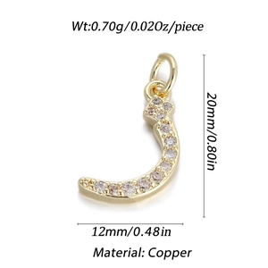 Macro detail of a 14K gold-plated Arabic letter J pendant with zircon stones and measurements