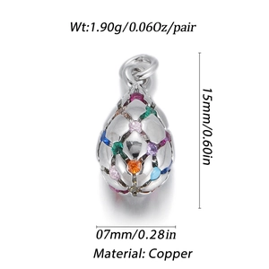 Macro view of 14K gold-filled copper teardrop pendants with colorful gemstones and cutout detail